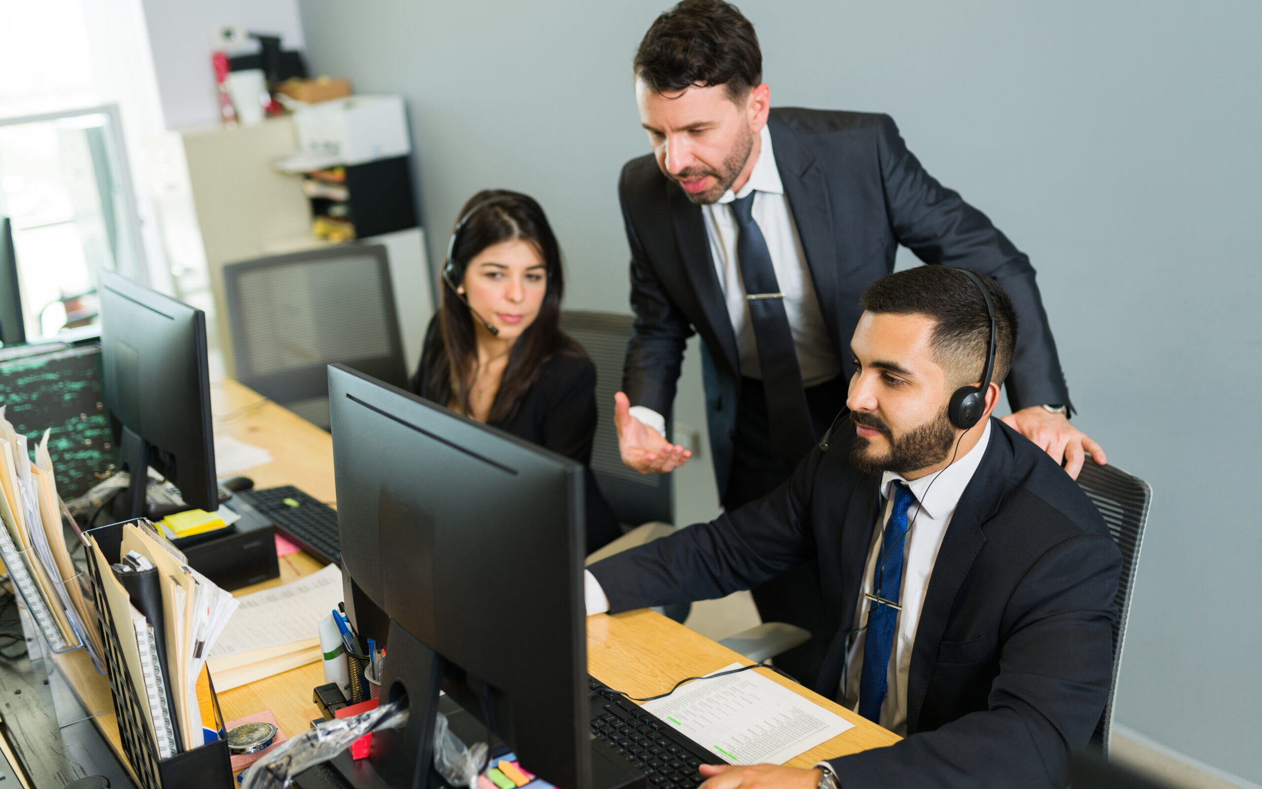 Boss supervising the work of the sales representatives