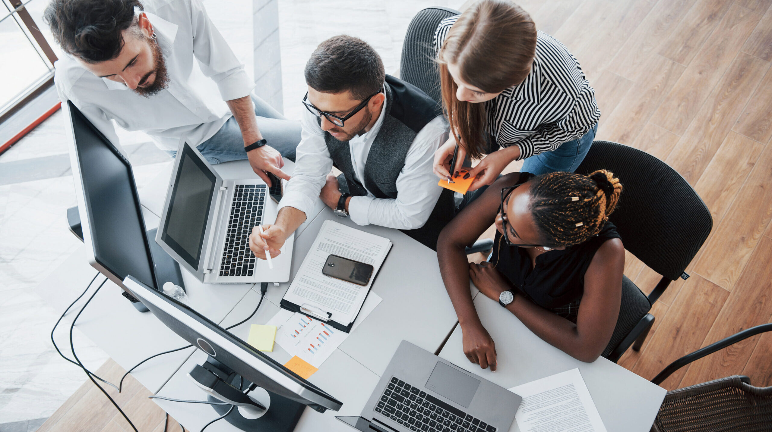 A group of multinational busy people working in the office.